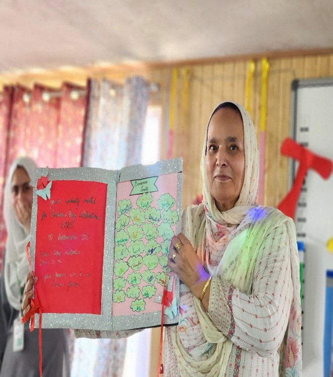Principal Ramzaan College Showing handmade invitation card for Teacher's Day 2024