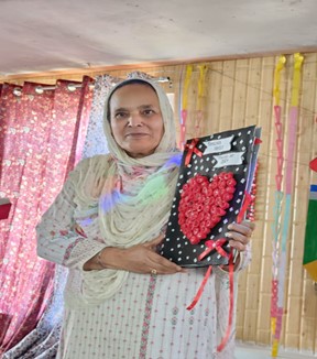 Principal Ramzaan College Showing handmade invitation card for Teacher's Day 2024